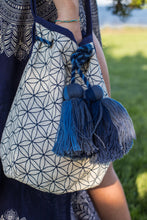 Boho Chic drawstring bag with blue tassels and geometric patterns