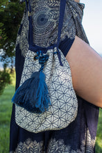Boho Chic drawstring bag with blue tassels and geometric patterns