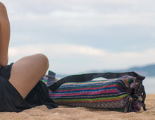 Wild Guru yoga mat bag on the beach. Colorful geometric design. 100% cotton. Adjustable strap. 